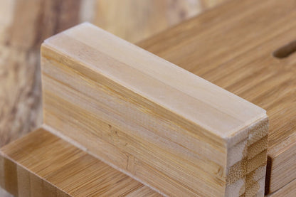 Close-up of Knifewear Sharpening Sink Bridge, showcasing laminated bamboo wood blocks for stable sharpening. Adjusts to fit sinks, enhancing safety and convenience.