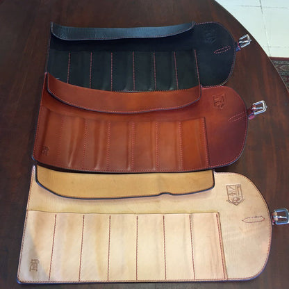 Odegard Seven Straight Razor Roll, handcrafted leather tool rolls, showcasing multiple stitched pockets and a buckle strap for secure closure, made by artisans in Alberta.
