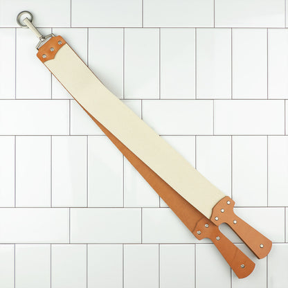 Ezra Arthur English Bridle Strop with leather and canvas sides, featuring handles and a hanging ring, designed for lasting razor maintenance and optimal shaving experience. Made in the USA.