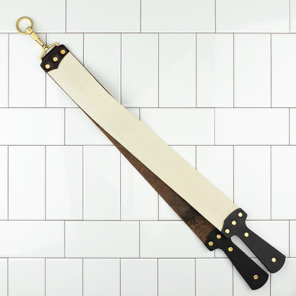 Ezra Arthur Cordovan strop with canvas and leather sides, brass hardware, designed for superior razor maintenance, enhancing longevity and performance.