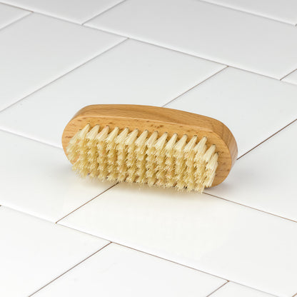 Kent of England Aqua Nail Brush features a wooden base and natural bristles, ideal for thorough cleaning and detailing under nails.