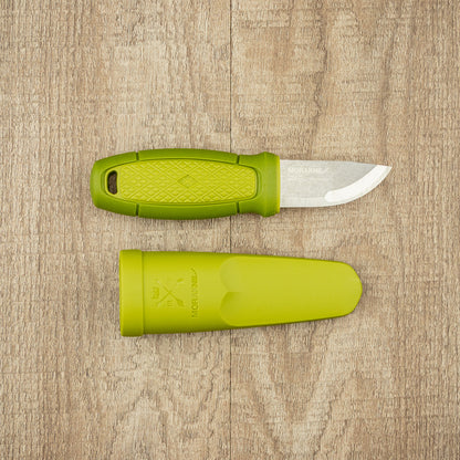 Mora Eldris Fire Kit: Compact utility knife with green handle and sheath, featuring a stainless steel blade and accessories for outdoor enthusiasts.