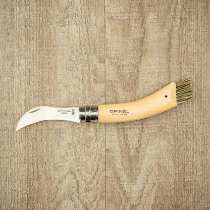 Opinel Inox No.08 Folding Mushroom Hunter’s Knife with Brush, featuring a hooked blade and beech wood handle, ideal for foraging with built-in cleaning brush.