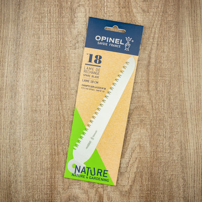 Opinel Folding Saw replacement blade, No. 18 serrated, 18cm stainless steel, packaged with brand details, ideal for gardening and trail clearing.