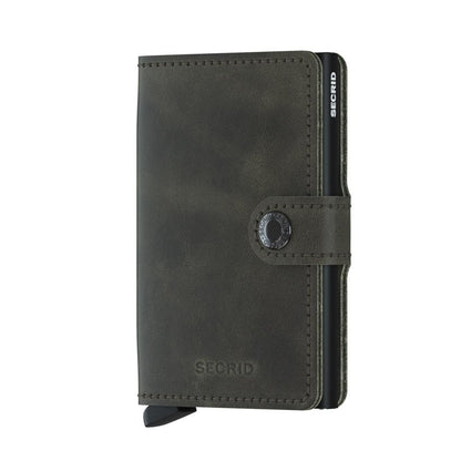 Secrid Wallets Miniwallet - Vintage: Compact leather wallet with snap closure and aluminum card-protector, featuring RFID-blocking, lever for card access, and room for cash and cards.