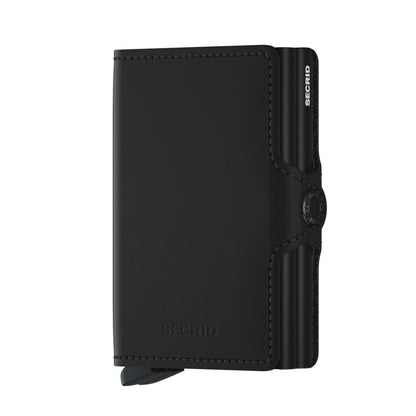 Secrid Wallets Twinwallet in black leather, featuring a snap-shut flap, internal aluminum card carrier, and bottom lever for easy card access. Holds 10-12 cards, cash, and more.