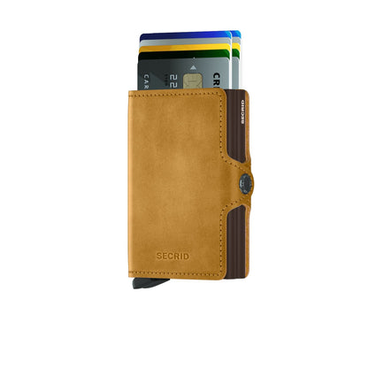Secrid Wallets Twinwallet with a metal card carrier, displaying fanned cards. Features a lever for easy access; holds 2-6 cards with RFID protection.