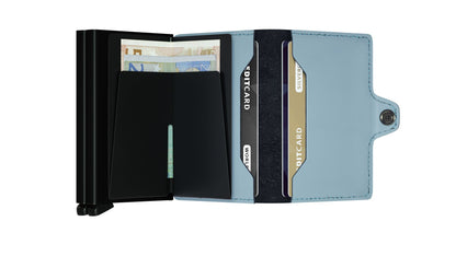 Secrid Wallets Twinwallet open, showing a black money-clip with Euros and a light-blue leather section holding two cards, offering stylish and organized storage.