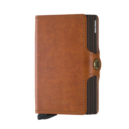 Secrid Wallets Twinwallet: Slim brown leather wallet with a metal Cardprotector, snap closure, holds 10-12 cards, cash, RFID blocking, hand-made in Holland.