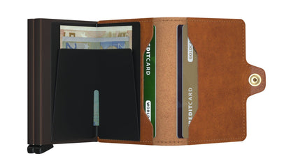Secrid Wallets Twinwallet open, showing euro notes in a clip and multiple card slots, including RFID protection, designed for organization and durability, handcrafted in Holland.