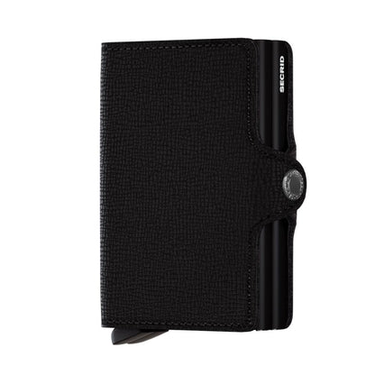 Secrid Wallets Twinwallet in black leather, featuring an aluminum card-holder, snap closure, and signature lever design for stylish, organized card access, handmade in Holland.