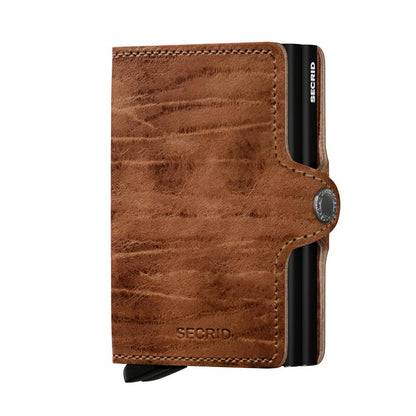 Secrid Wallets Twinwallet in distressed brown leather with contrast stitching, featuring a black cardprotector, snap-closure, and RFID blocking for organized, stylish card storage.