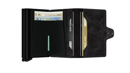 Secrid Wallets Twinwallet: Slim, minimalist design with metal money clip and leather card holder, holding up to 12 cards, cash, and business cards. RFID-blocking, handmade in Holland.