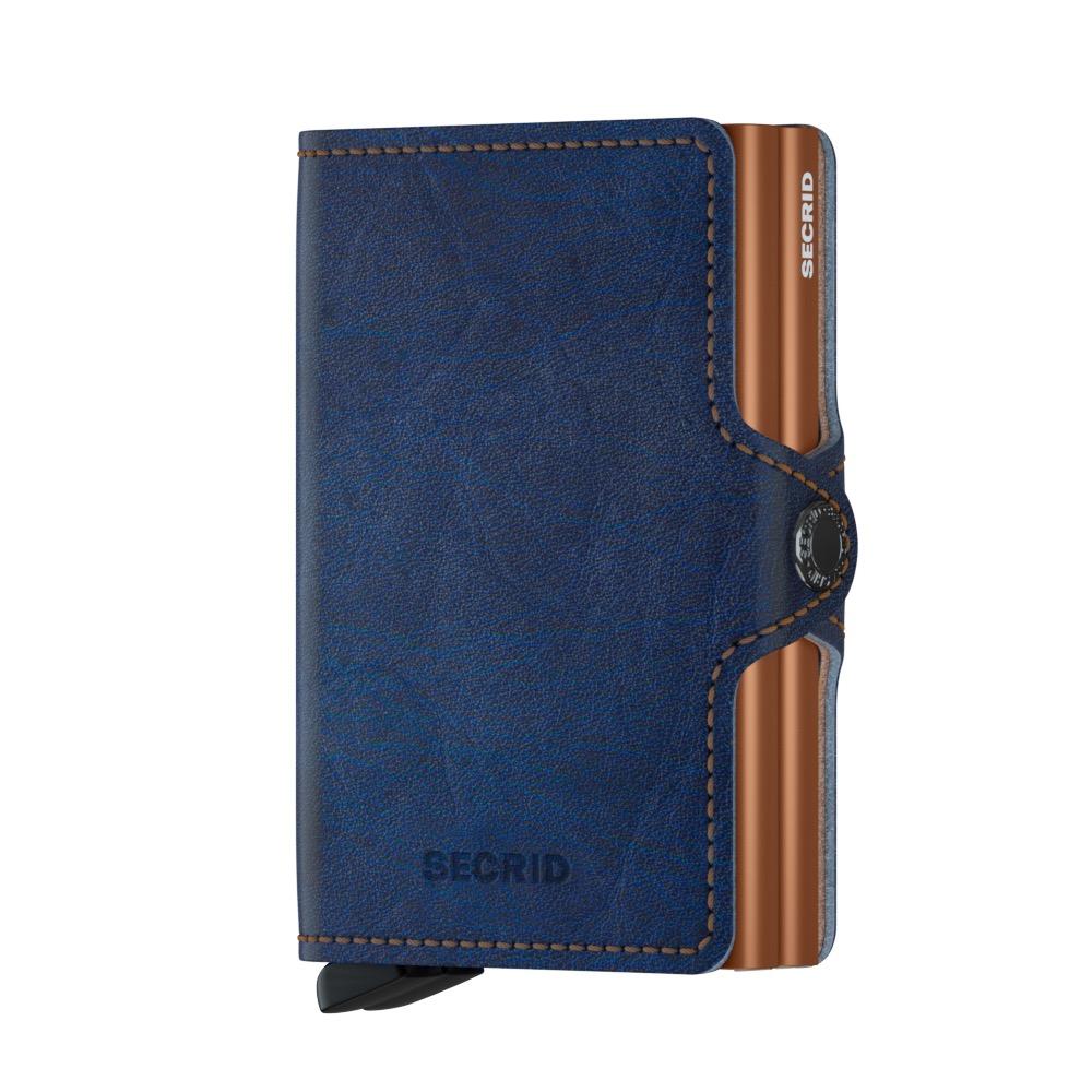 Secrid Wallets Twinwallet: Slim, blue leather cardholder with a copper-toned aluminum case, holding up to 6 cards. RFID blocking, hand-made in Holland.