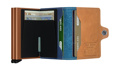 Secrid Wallets Twinwallet features a copper-finished card-carrier and tan leather cover, holding 10-12 cards, cash, and more, with RFID blocking.