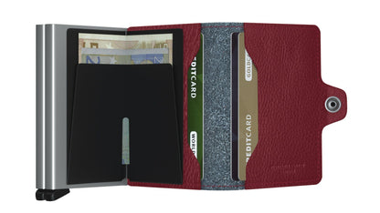 Secrid Wallets Twinwallet with RFID-blocking card case and red leather folio, holding euro notes and various credit cards in organized vertical slots.