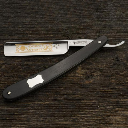 Dovo Astrale Straight Razor, Ebony Handle, 5/8, featuring gold celestial blade design, open on wood, ideal for a classic, quality shave experience.