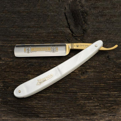 Dovo Pearl Straight Razor with imitation pearl handle and gold-toned blade, 5/8 size, displayed on a wooden surface, ideal for classic shaving enthusiasts.