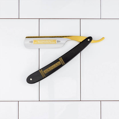 Dovo Bismarck Straight Razor 6/8” with Bismarck and Solingen inscribed, showcased on white tiles, highlighting its classic craftsmanship and premium materials.