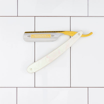 Dovo Bismarck Straight Razor 6/8” with mother-of-pearl–style handle and “BISMARCK” blade, displayed open on white tiles.