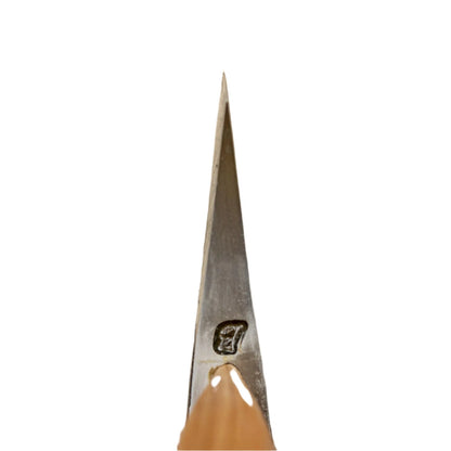 Close-up of a Brant & Cochran Dirigo Belt Axe tip, showcasing its sharp steel point emerging from a polished wooden handle with a stamped maker's mark.