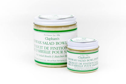 Two glass jars of Clapham’s Beeswax Salad Bowl Finish, a food-safe blend, designed to nourish and seal wooden surfaces like salad bowls and cutting boards.