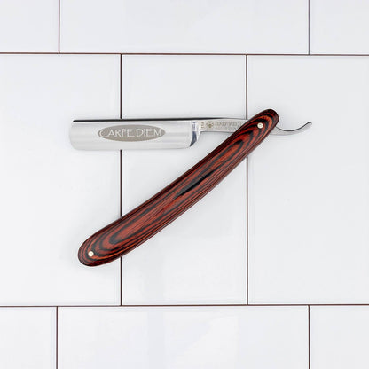 Dovo Carpe Diem 5/8” Straight Razor with engraved blade and Pakka-wood handle, exemplifying classic shaving elegance and precision.