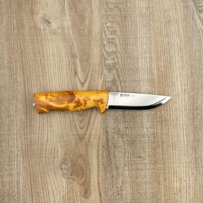 Helle Knives Eggen 100mm Hunting Knife displayed on wood, featuring a polished steel blade with etching and an amber-toned wooden handle.