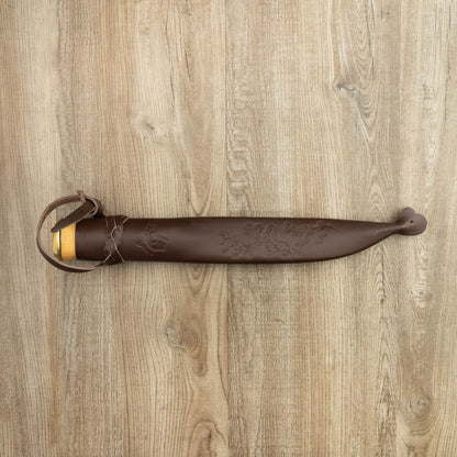 Helle Knives Lappland 214mm Hunting Knife with a wooden handle, brass collar, and embossed brown leather sheath featuring a hanging strap, displayed on a wood-grain surface.