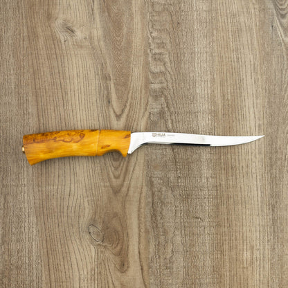 Helle Knives Steinbit 155mm Fillet Knife with a smooth wooden handle, designed for precision filleting, displayed on a wood-grain surface.