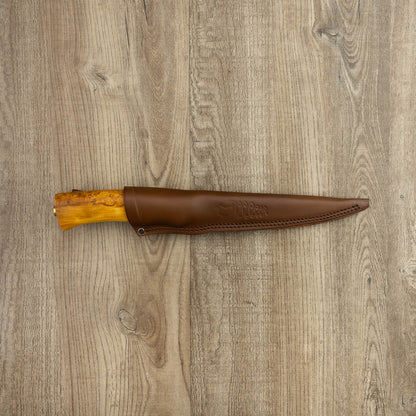 Helle Knives Steinbit 155mm Fillet Knife sheathed in brown leather, featuring a semi-flexible blade and light wood hilt, ideal for precise filleting.