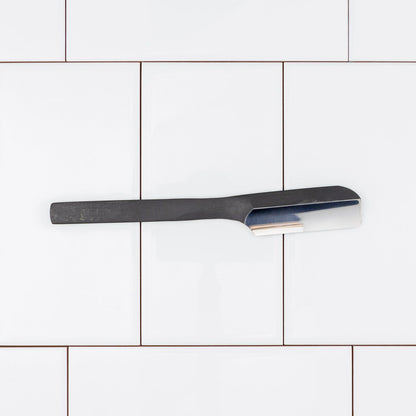Takami Kamisori Japanese Straight Razor Western Grind with a dark matte handle and polished blade, designed for precise, user-friendly shaving.