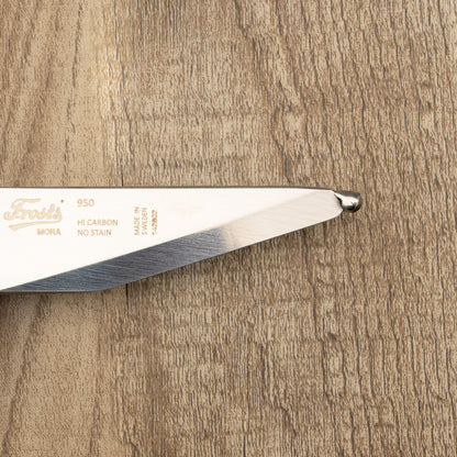 Mora Frosts Roeing & Bleeding Knife blade close-up, showcasing its durable 12C27 stainless steel with a strong Scandi grind edge, ideal for game dressing.