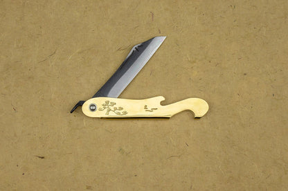 Mujun Mt. Fuji Folding Knife: Brass handle with pine-tree engraving, tanto blade, bottle opener, nail cleaner, crafted in Miki, Japan for durability and multifunctional use.