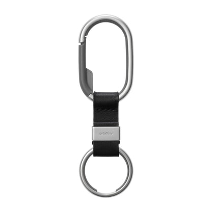 Orbitkey Clip with silver carabiner, black leather strip, and metal key ring, designed for organizing keys and carrying items up to 4kg.