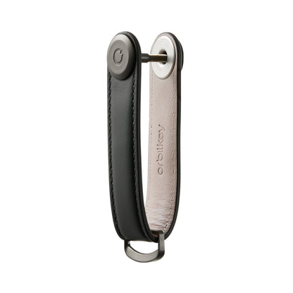 Orbitkey Leather Key Organizer, a sleek leather strap with a pivot bolt and D-ring, neatly holds and fans out 2-7 keys for easy access.