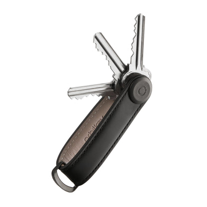 Orbitkey Leather Key Organizer showcasing black leather fob with pivoting post, neatly fanning metal keys, includes D-Ring for larger items, designed for organized everyday carry.