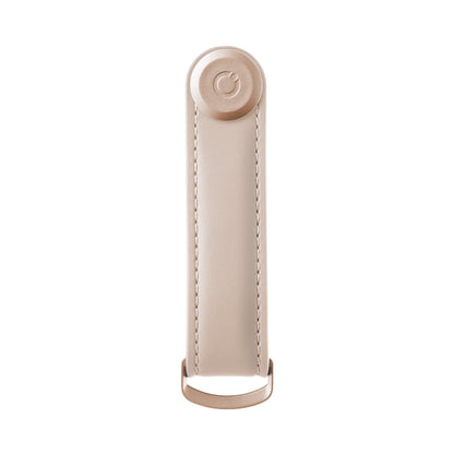 Orbitkey Leather Key Organizer in sand tone, featuring a stitched leather loop, metal snap with logo, and D-ring for attaching keys.