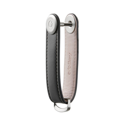 Orbitkey Leather Key Organizer, a sleek leather loop for organizing 2-7 keys, features a top screw mechanism and a D-ring for easy attachment to bags or belts.