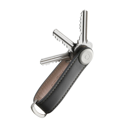 Orbitkey Leather Key Organizer, showcasing keys pivoted out Swiss-army style, with a metal D-ring for attaching larger items, neatly designed for everyday carry.
