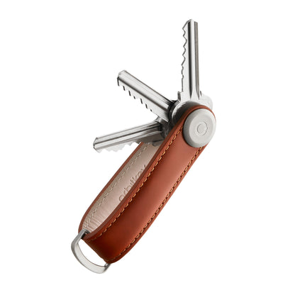 Orbitkey Leather Key Organizer with fanned-out keys, showcasing a sleek, compact design for organizing up to seven keys, featuring a stainless steel locking mechanism and leather craftsmanship.