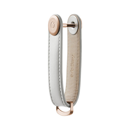 Orbitkey Leather Key Organizer with rose-gold screw, neatly stacks 2-7 keys; includes a D-ring for attaching larger items. Hand-crafted leather, designed for organized, quiet carrying.