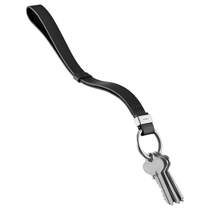 Orbitkey Strap: Black leather wrist-strap keychain with metal key ring, featuring three silver keys and a small metal clasp. Designed for easy key retrieval.