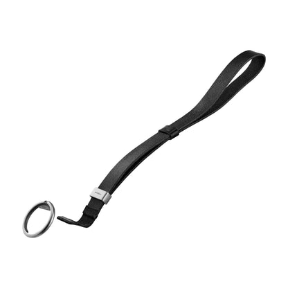 The Orbitkey Strap, a sleek black leather wrist-loop with a metal clasp and key-ring, ideal for organizing keys or small fobs efficiently.