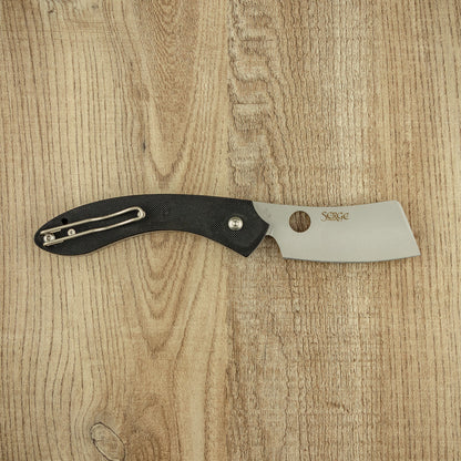 Spyderco ROC G10 folding knife with a mini-cleaver blade, thumb-hole for easy opening, and textured black G-10 handle on a wood surface.