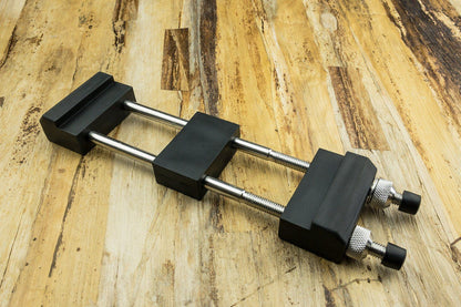 Stone Holder: A compact two-rod bar clamp with adjustable screws, ideal for securing sharpening stones during woodworking or craft tasks. Perfect for steady, precise sharpening.