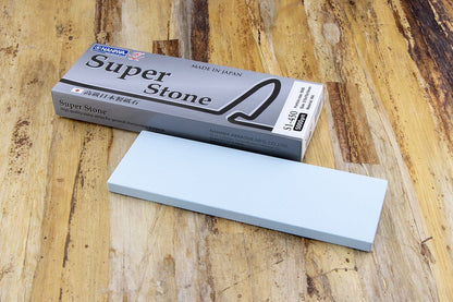 Naniwa Specialty/Super Stone 5000 210x70x10mm whetstone on wood surface, ideal for precise honing without excessive steel removal.