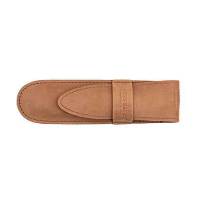 Thiers Issard Straight Razor, Gold Medallion Rams Horn, 5/8, nestled in a light tan suede sheath with debossed branding. Ideal for classic shaving enthusiasts.