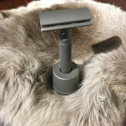 Rockwell Razors Stainless Steel Stand for Double Edge Safety Razor displayed upright on a soft surface, emphasizing craftsmanship and elegance.